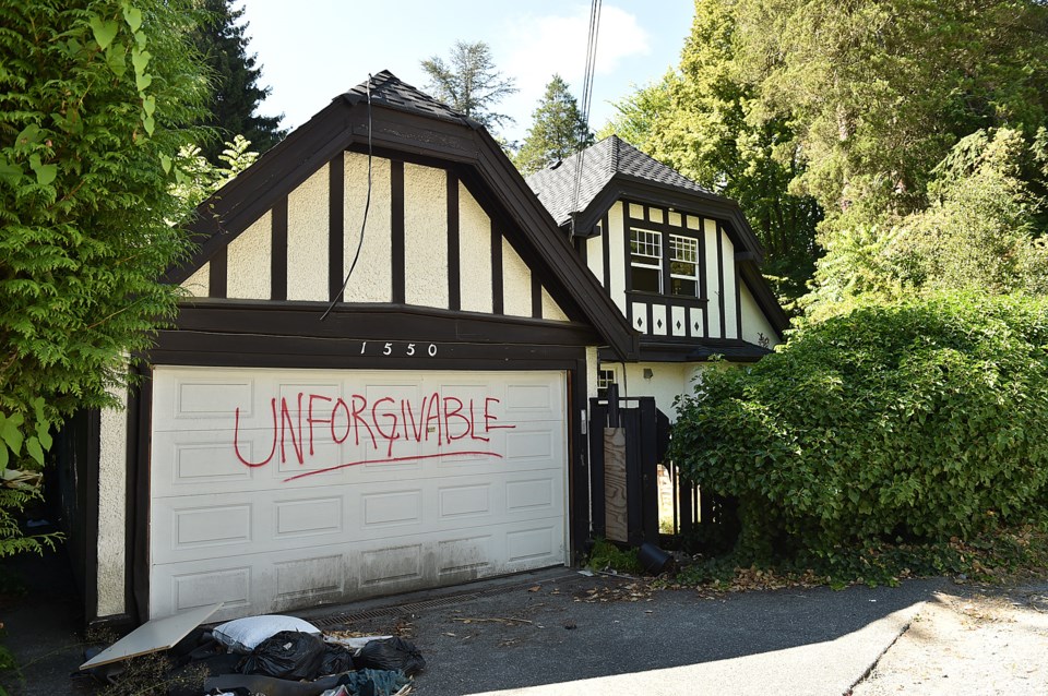 Offensive graffiti has appeared on a home that's slated to be demolished. Photo Dan Toulgoet