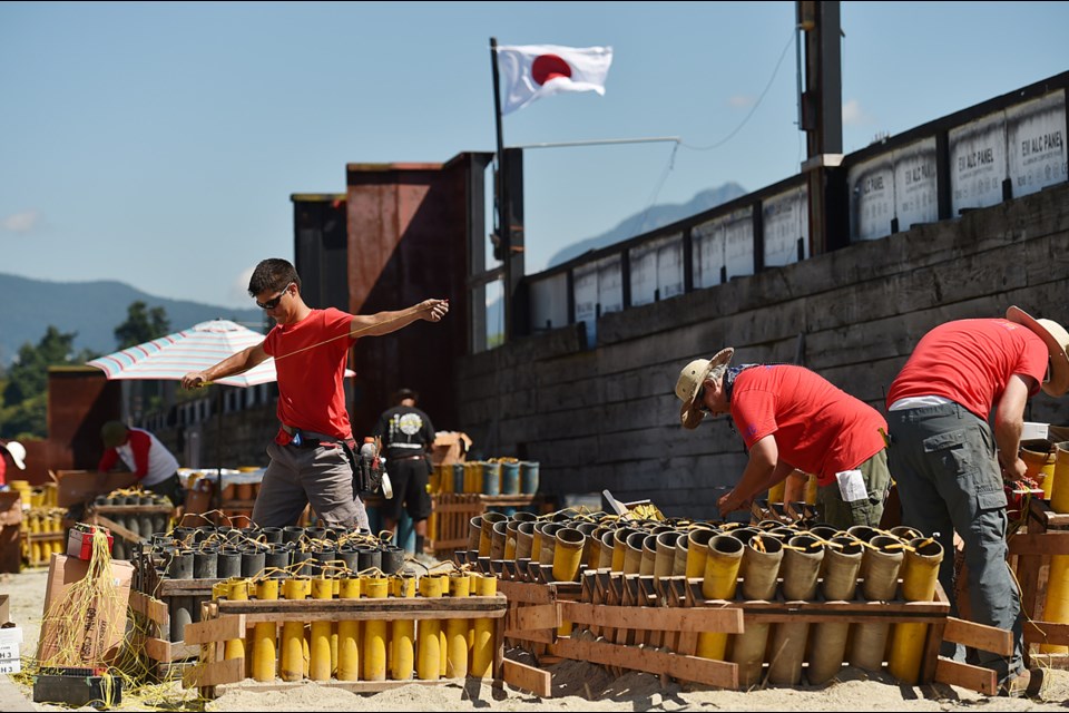 Preparations for the Celebration of Light fireworks were underway Friday. Photo Dan Toulgoet