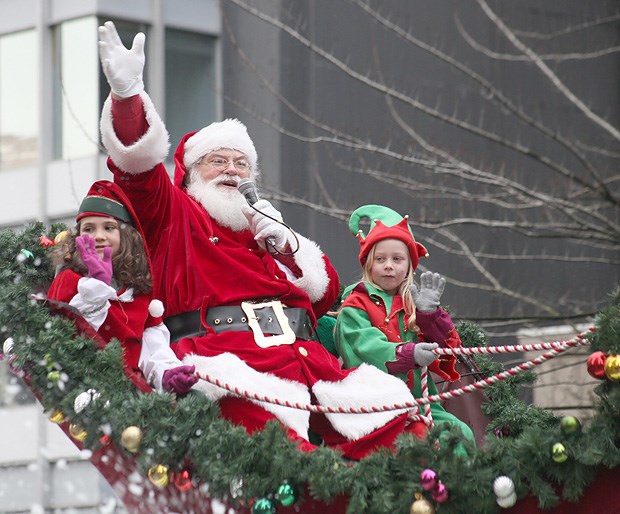 Crowds lined the streets of Georgia and Howe for the annual Rogers Santa Parade Sunday. The parade featured an array of floats, marching bands,
musical and dance performances, along with Santa himself.