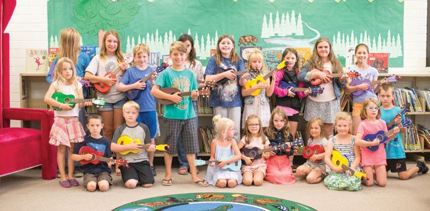 Youngsters gathered at the Tsawwassen Library last Wednesday for Uke ‘n Play: Ukulele Basics for Kids. Children learned how to hold, tune and strum it during the 90-minute workshop.