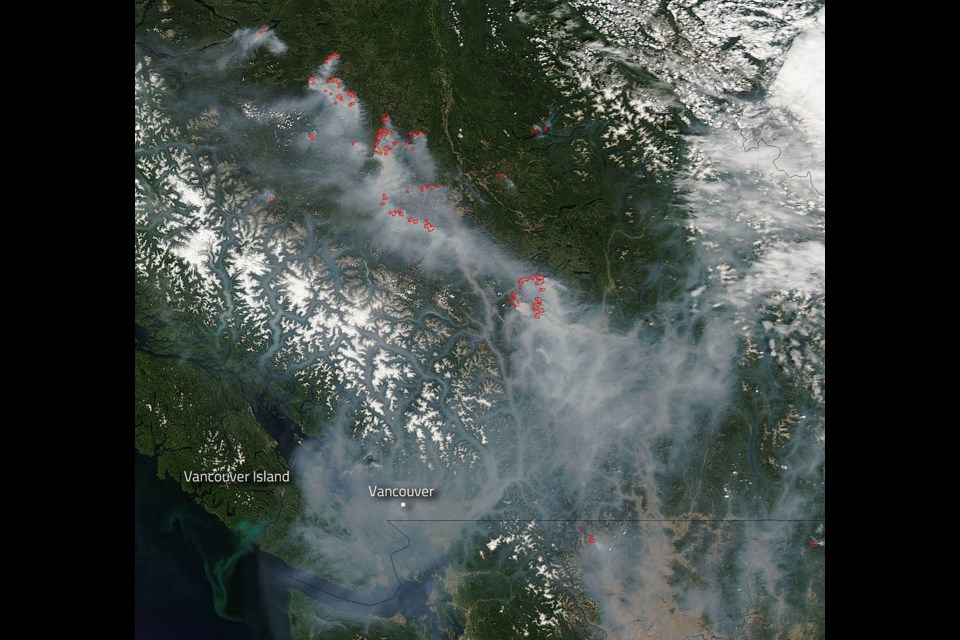 This photo taken from space by NASA, shows smoke from B.C. wildfires blanketing the province and northern Washington State.