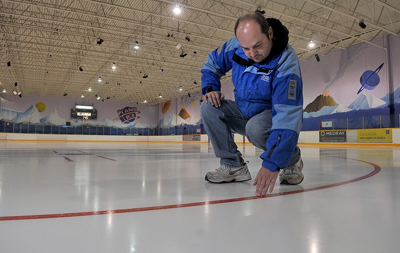 MARIO BARTEL/THE TRI-CITY NEWS
Paul Lalande, the operations manager of Planet Ice in Coquitlam, checks the progress of ice making on one of two pads being installed this week. He said it takes about a week to build the ice to its required thickness of an inch before skaters are allowed on it.