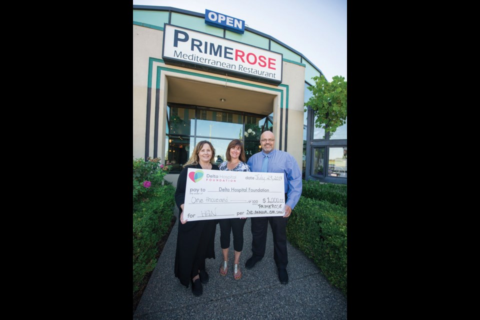 The Primerose Mediterranean Restaurant in Ladner hosted its second annual Hotrod & Classic Car Show last month, which also acts as a fundraiser for the Delta Hospital Foundation. Below, Shari Barr of the foundation receives a $1,000 cheque from Maria and Sia Adjudani, owners of the Primerose. The Adjudanis have donated $2,000 to the hospital through fundraising efforts in 2017.