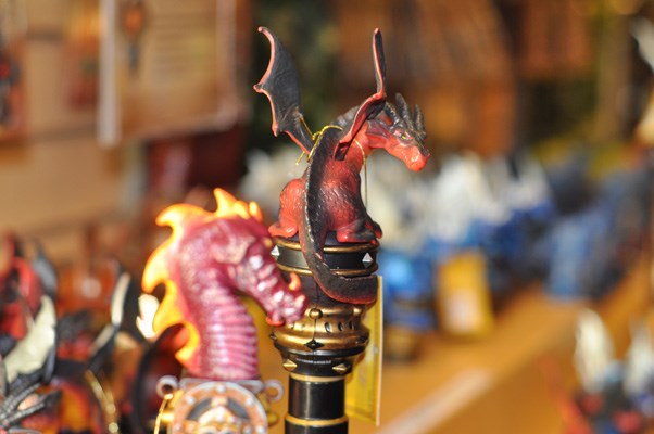 A red dragon is one of the many "toppers" with which kids can customize their MagiQuest wands.