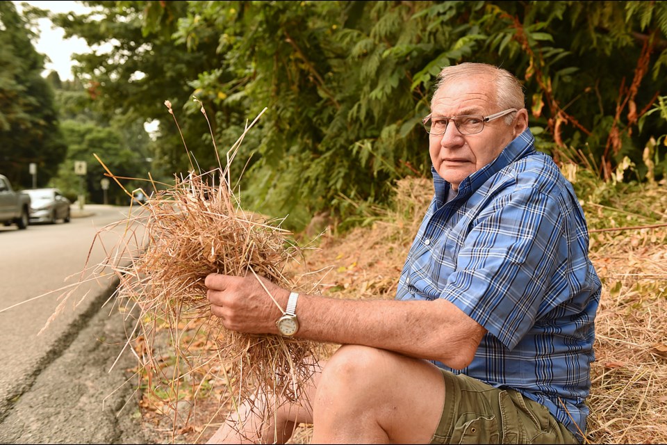 West Side resident Terry Slack is worried cut grass left to dry along the perimeter of Pacific Spirit Park could act as kindling during this time of extreme fire hazard warnings.
