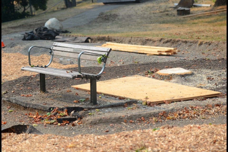 A mature tulip tree that used to shade this tribute bench near Parkcrest Elementary was cut down as part of the redevelopment of the playground.