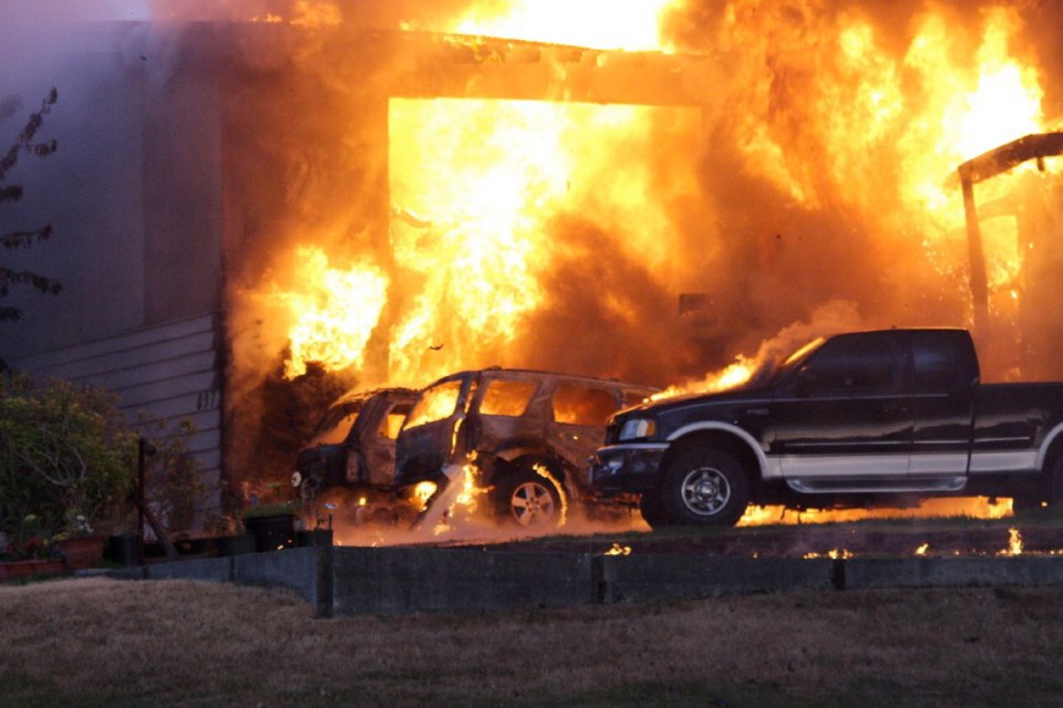 Flames spread to vehicles parked in driveway on South Alder Street in Campbell River.