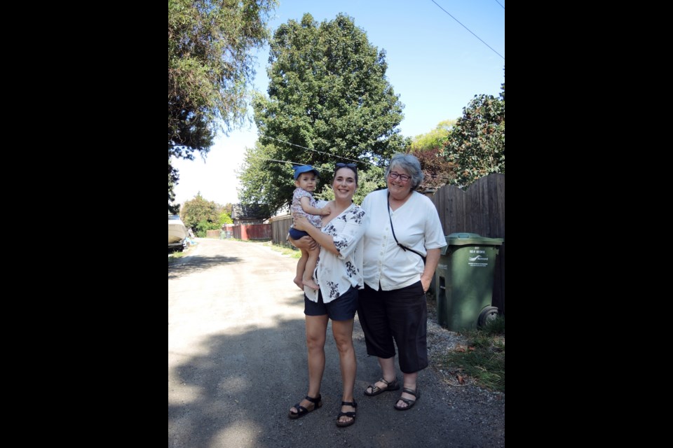 Meg Holdsworth, here at her Burkeville residence with daughter Kathryn O’Leary and granddaughter Niamh, wants to build a laneway home for herself to live in while her daughter’s family takes over the main house. Photo by Graeme Wood / Richmond News