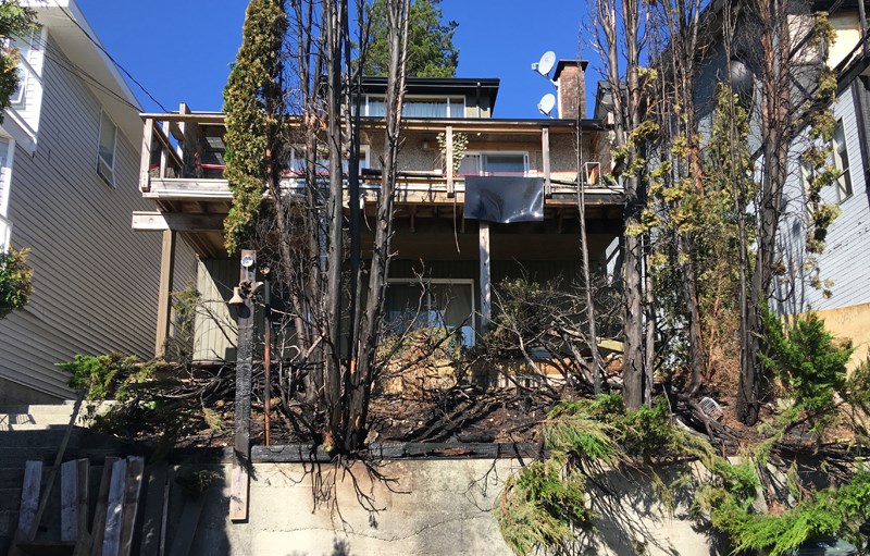 A fire that started in the trees and bushes behind 20 and 24 Ellesmere Avenue Sunday afternoon spread to the deck of one of the houses.