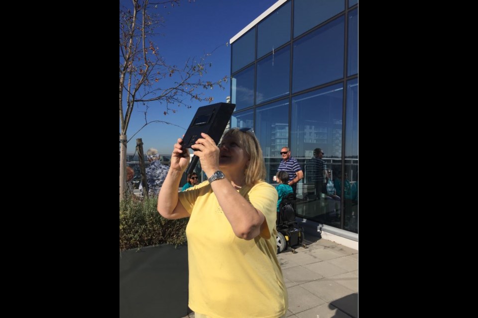 Coun. Lorrie Williams hosted at an eclipse viewing party she held on the patio of the Anvil Centre Office Tower Monday morning.