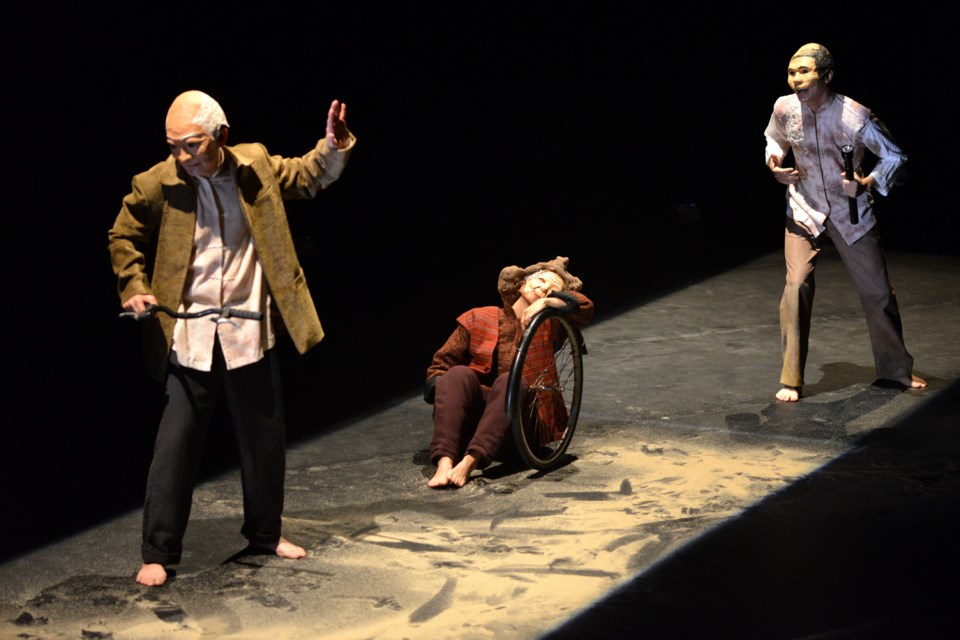 Masked characters for Travel with Mum act on a stage of sand to provide a unique dimenson to the Gateway Theatre Pacific Festival play, featuring award-winning actors. Photo submitted.