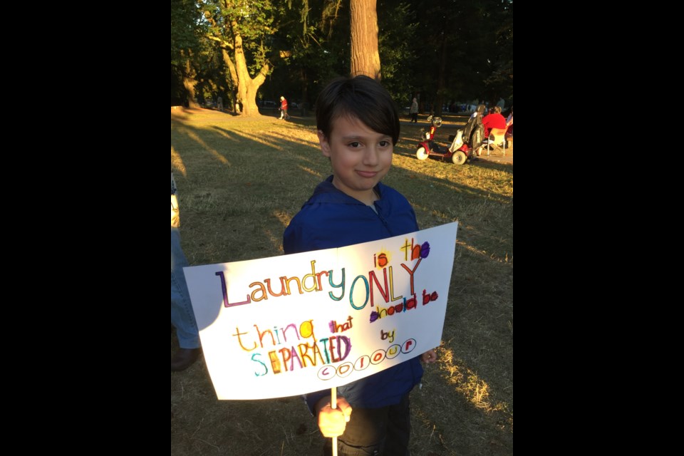 Residents of all ages, seven-year-old son Alexandro Gomez-Balcazar, gathered in Moody Park on Aug. 17 for a New West United anti-racism demonstration.