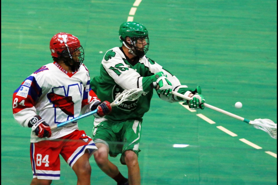 New Westminster's Drew Belgrave, left, covers Victoria’s Corey Small during Game 5 on Sunday.