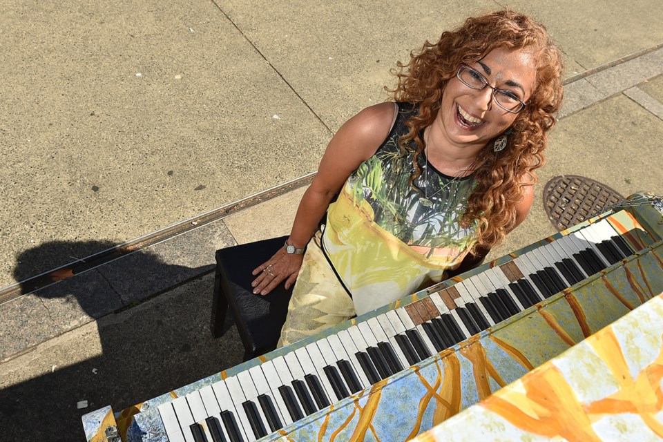 Rose L. Williams was one of two artists from Kickstart Disability Arts and Culture to paint a piano for the Pianos on the Street program. Photo Dan Toulgoet
