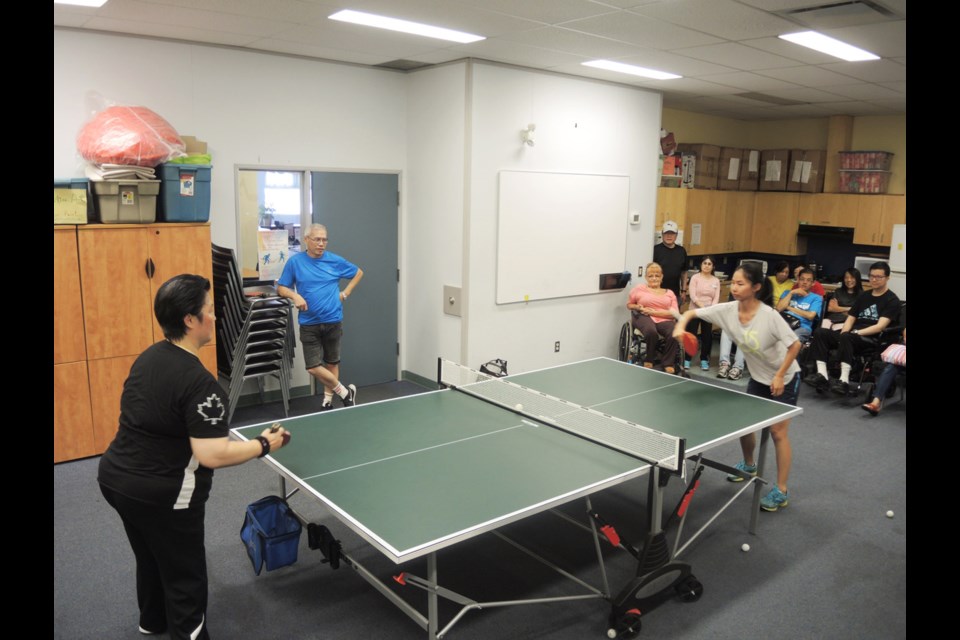 Canadian Paralympic athlete Chim-Hing (Stephanie) Chan recently took on Richmond News reporter Daisy Xiong (left) at the Richmond Centre for Disability. Photo submitted