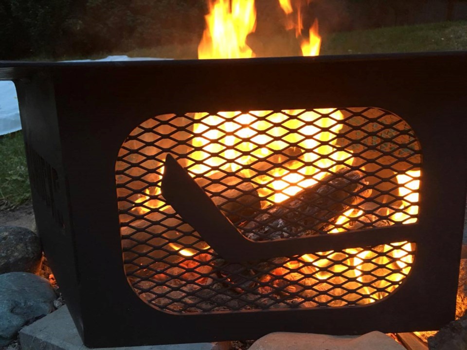 Canucks fire pit - stick in rink