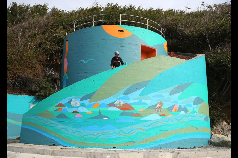 Luke Ramsey finishes his mural at the Dallas Road spiral staircase. The work is called Mother Protector - Hawk and Home. A community celebration takes place on Saturday from 10 a.m. to 1 p.m.