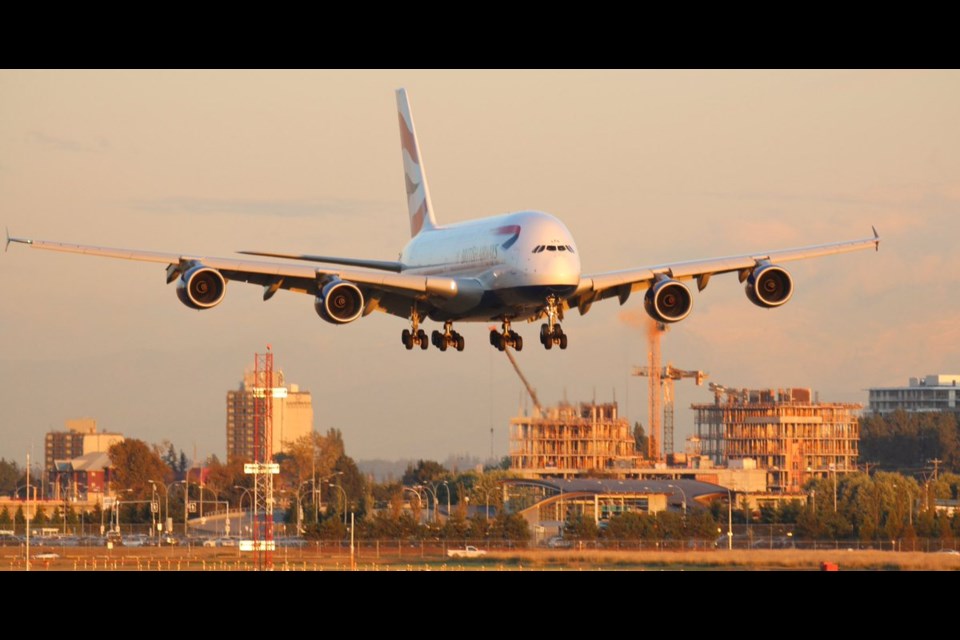 An airplane lands at Vancouver International Airport after flying over City Centre condos under construction. Photo by Kent Matthiesen‏ / @kenters55. September, 2017.