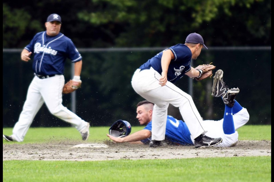 Burnaby Blue Jays’ Adam Ladouceur beats the tag of a Richmond Rainier infielder during Saturday’s Lower Mainland Baseball League over-30 division final. The Blue Jays racked up a nestful of hits en route to an 11-2 victory.