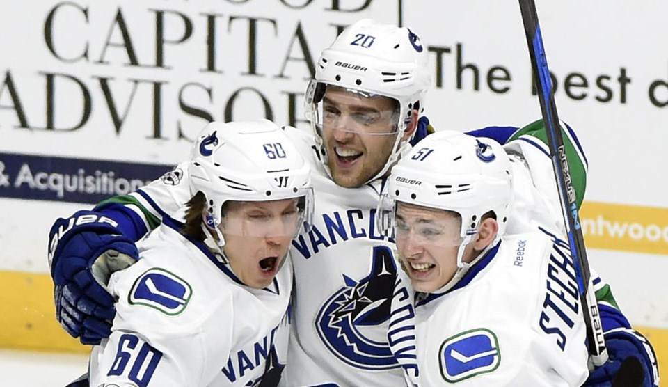 Brandon Sutter, Markus Granlund, and Troy Stecher seem pretty excited