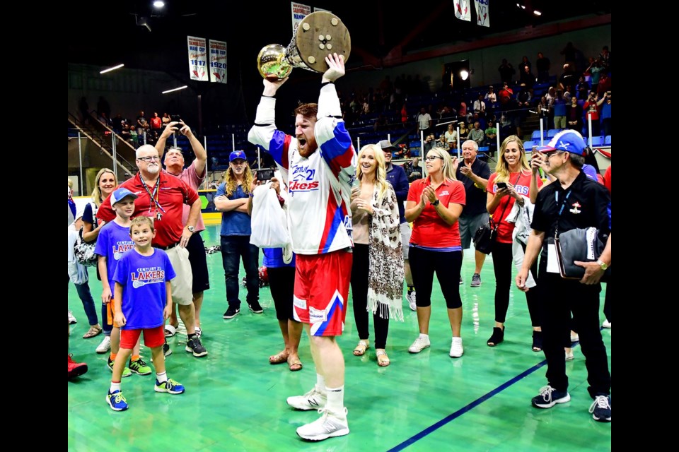 Former New West junior and PoCo native Curtis Dickson raises the Mann Cup after helping his Peterborough Lakers defeat the New West senior Salmonbellies in the national championship final at Queen's Park Arena.