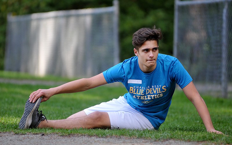 MARIO BARTEL/THE TRI-CITY NEWS
Macarthy Whyzel, of Dr. Charles Best secondary school, stretches prior to the start of his event at a cross country mini meet Wednesday at Mundy Park in Coquitlam.