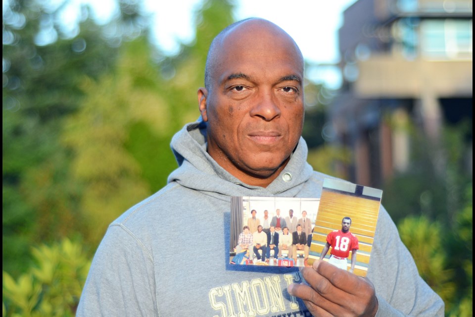 Former SFU football player Richard White holds snapshots from his days as an SFU Clansmen between 1979 and 1982. White, an Oakville, Ont. native, is proud of his Scottish roots and sees the university’s team name “the Clan” as a symbol of unity and resilience. To the Americans he played against, though, he says the name invoked the spectre of the Ku Klux Klan.