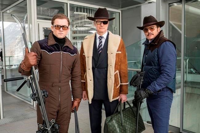 FILE - This file image released by Twentieth Century Fox shows, from left, Taron Egerton, Colin Firth, and Pedro Pascal in "Kingsman: The Golden Circle." The R-rated spy comedy ‚ÄúKingsman: The Golden Circle‚Äù has taken over the top spot at the North American box office with an estimated $39 million debut. The 20th Century Fox release pushed the Stephen King sensation ‚ÄúIt‚Äù into second place in its third week of release.(Giles Keyte/Twentieth Century Fox via AP, File)