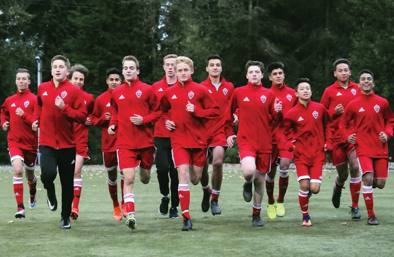 Members of the Mountain United U15 boys team warm up before a recent training session at Sutherland Secondary. The team, made up predominantly of players from Burnaby and the North Shore, won the B.C. Soccer Premier League title in June and will be looking for gold at the national championships running Oct. 4-9 in Calgary. photo Cindy Goodman, North Shore News