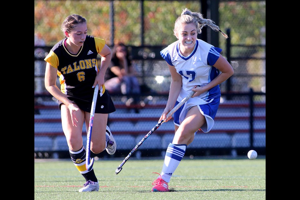 MARIO BARTEL/THE TRI-CITY NEWS
Dr. Charles Best forward Liana Barzal tries to corral the ball from Gleneagle Talons defender Cassie Questroo in the first half of their Fraser Valley High School Girls Field Hockey Association match, Thursday at Coquitlam's Town Centre Park.