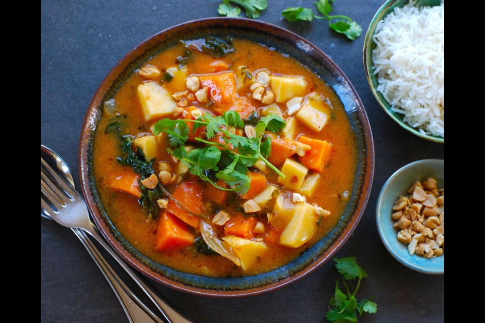 Sweet potatoes and yams combine in coconut-milk-based curry, which also contains kale and peanuts.