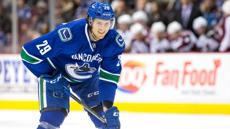 Andrey Pedan smiles with the Vancouver Canucks