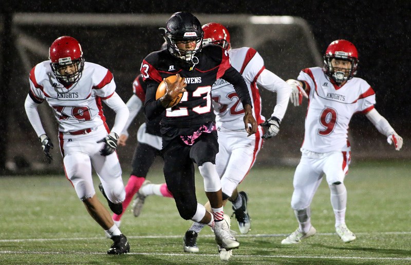 MARIO BARTEL/THE TRI-CITY NEWS
Terry Fox running back Jaden Severy breaks away from a trio of St. Thomas More tacklers in the first half of their BC High School Football Association AAA game, Friday at Percy Perry Stadium in Coquitlam. STM beat the top-ranked Ravens 15-8.
