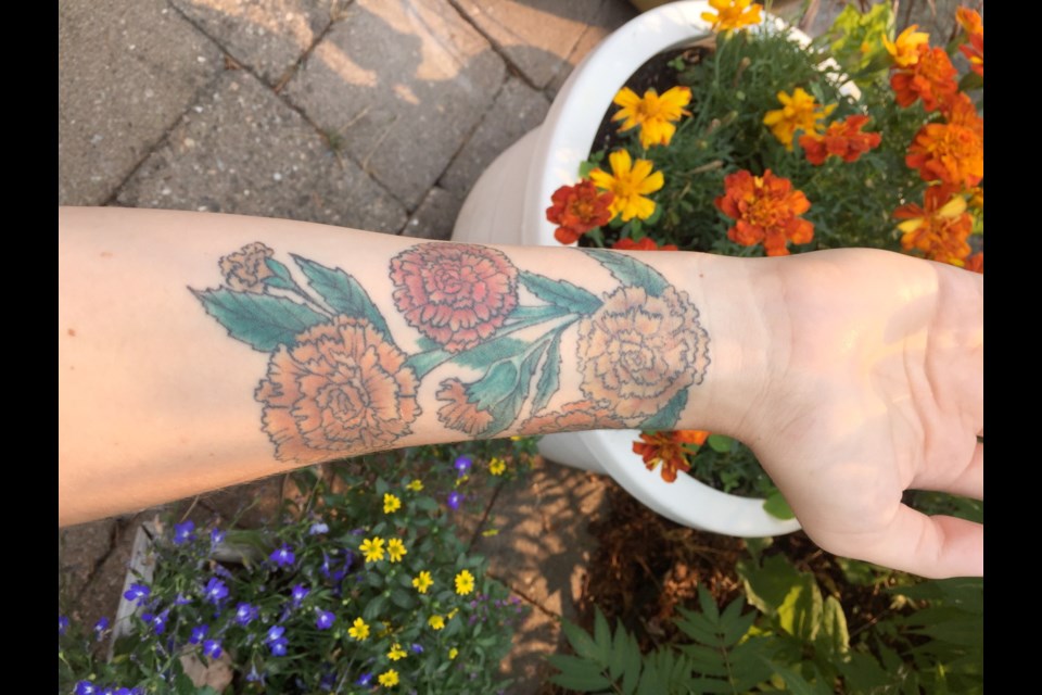 Michaela Evanow's marigold tattoo is a memorial to her daughter, Florence.