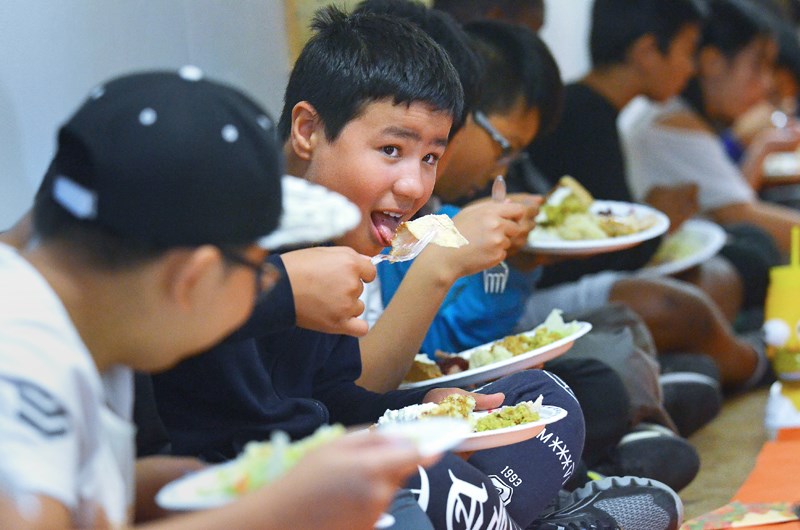 Windsor Elementary School Grade 7 student Nour El-Amil digs in during his school's annual Thanksgiving dinner last week.