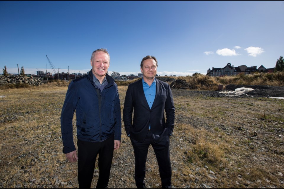 Norm Shearing, president of Vancity's Dockside Green Limited, left, and Ryan Bosa, of Vancouver-based Bosa Development at Dockside Green's future development site in Vic West.