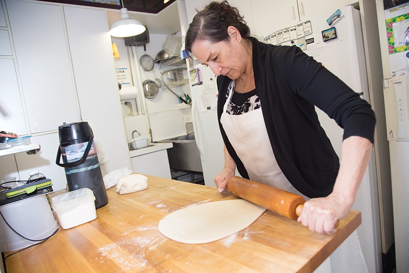 Emma Carnero rolls some pastry dough at El Dorado Pie & Treats.