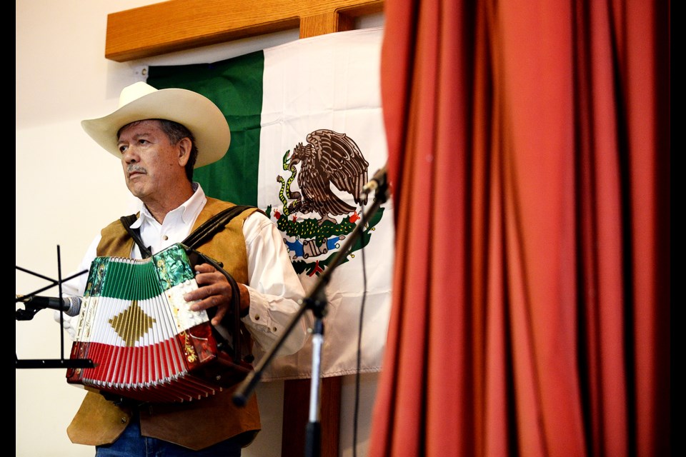Roberto Talomino plays the accordion on Saturday at St. Barnabas Church's fundraiser for communities devastated by earthquakes in Mexico.