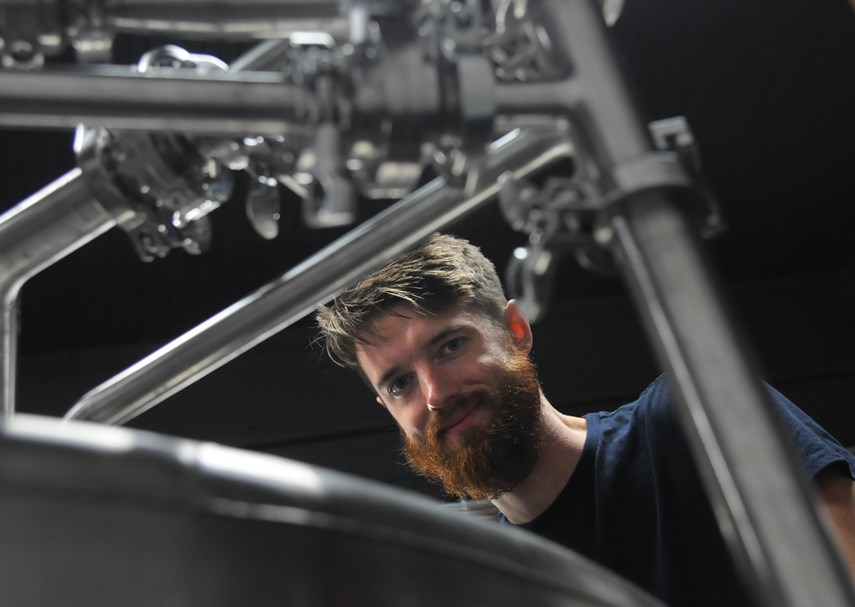 Co-owner and head brewer Matt Beere checks the tanks at the soon-to-be-opened Beere Brewing Company. The Lower Lonsdale shop, formerly a timber warehouse, will be the North Shore’s sixth craft brewery. photo Mike Wakefield, North Shore News