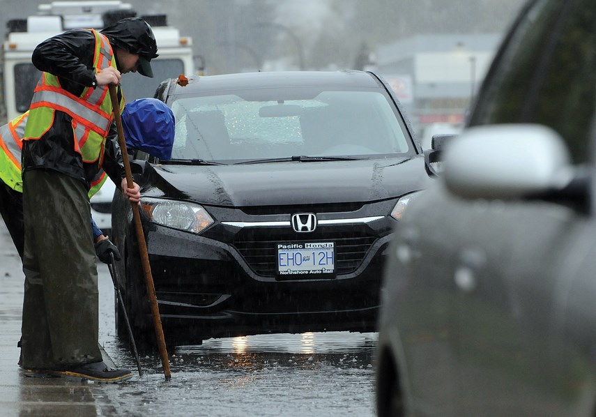 Heavy rain dampens spirits and streets of the North Shore