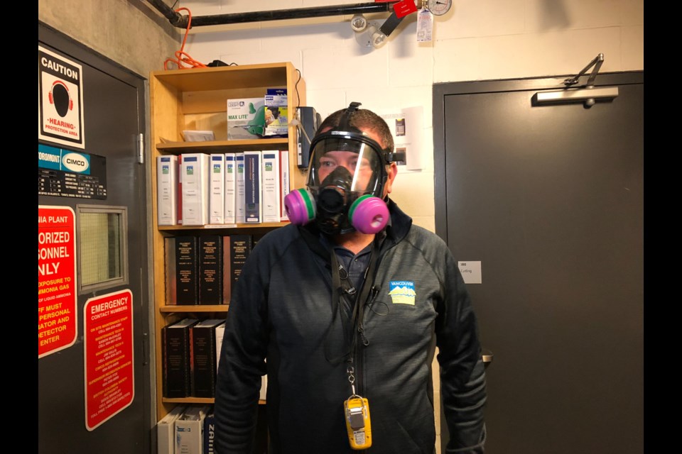 Eamon McGinley, chief engineer at Hillcrest Community Centre, demonstrates the safety equipment employees must use when working on and around the facility’s refrigeration unit. Photo Jessica Kerr