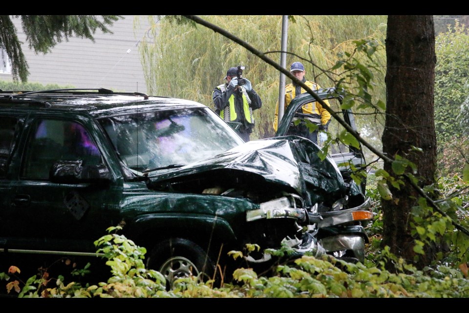 Victoria and Saanich police investigate the scene of a motor vehicle accident on Gorge Road West near Milgrove Street in Saanich on Wednesday, Oct. 18, 2017.