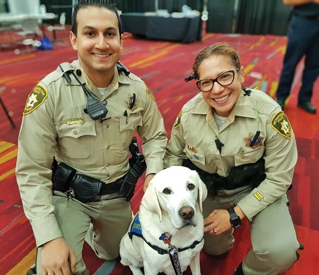 Caber visits with Las Vegas police officers.