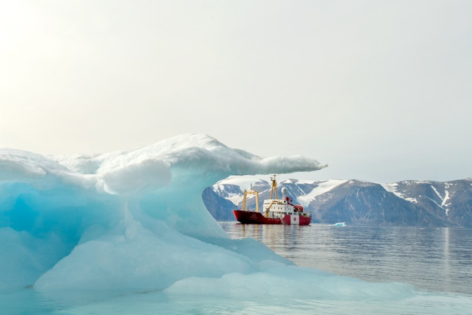 The Canada C3 ship, with sea ice in the foreground, outside Sirmilik National Park near Pond Inlet, Nunavut, on leg 8 of the journey in early August.