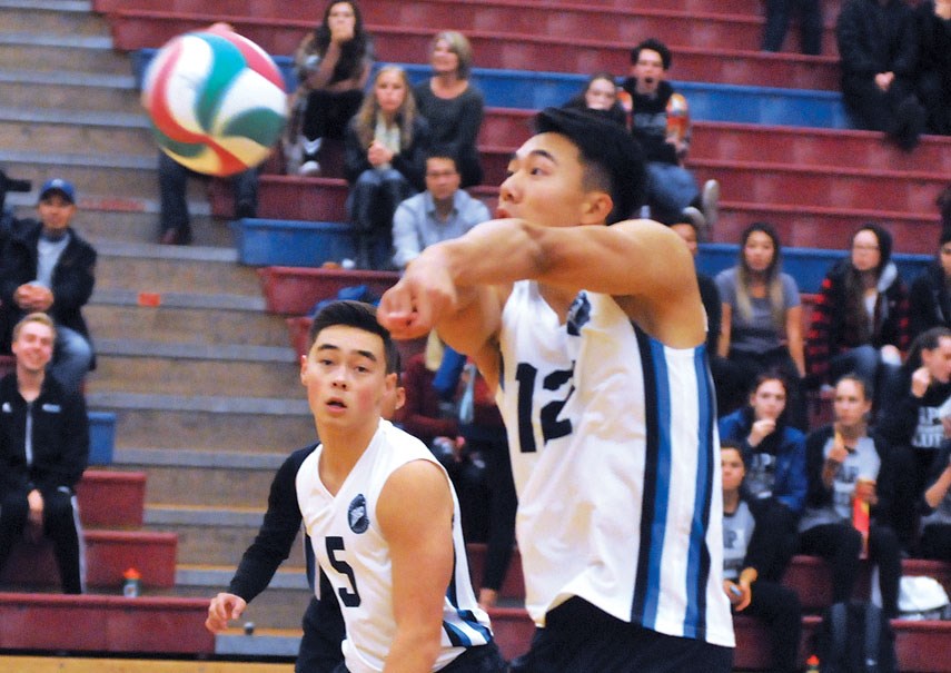 Cameron Fay of the Capilano Blues men’s volleyball team makes a pass while teammate Justin Yee provides support during a season-opening win over Douglas College Oct. 13. The Blues are 4-0 to start the season, alone in top spot as the only undefeated PacWest team. photo Paul McGrath, North Shore News