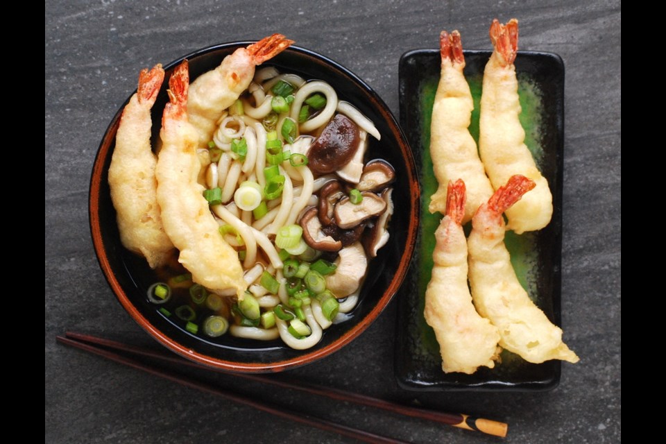 Tempura udon is made by serving brothy noodles with crisp and yummy tempura prawns.