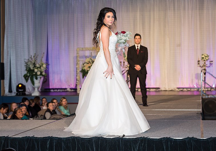 A model shows off the latest in bridal gown styles during the Storybook Wedding fashion show that was held during the Storybook Wedding Bridal Expo on Sunday at the Prince George Civic Centre. Citizen Photo by James Doyle