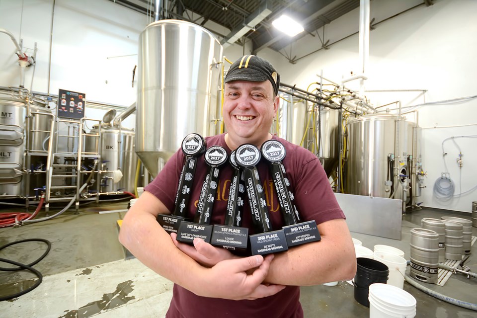 Ben Coli, owner of Dageraad Brewing, shows off the awards his brewery won at the annual beer awards last month. The Burnaby-based brewery took home five trophies, including three gold ones.