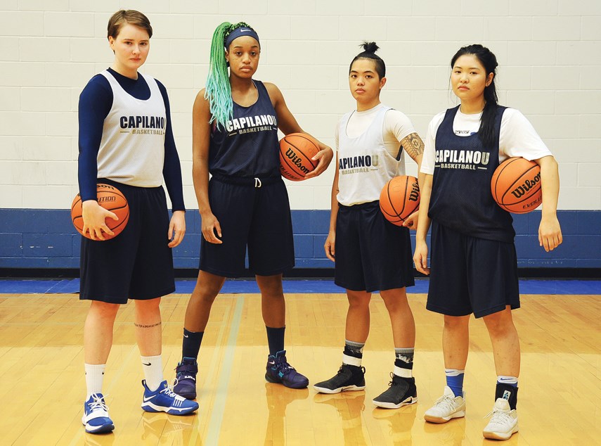 Emma Cunningham, Carmelle M’Bikata, Ashley De La Cruz Yip and Reiko Ohama of the Capilano Blues baskeball team are ready to get their season underway. The Blues have a lot of experience on their team this year and will be hunting gold after finishing second in each of the past two seasons. photo Cindy Goodman, North Shore News