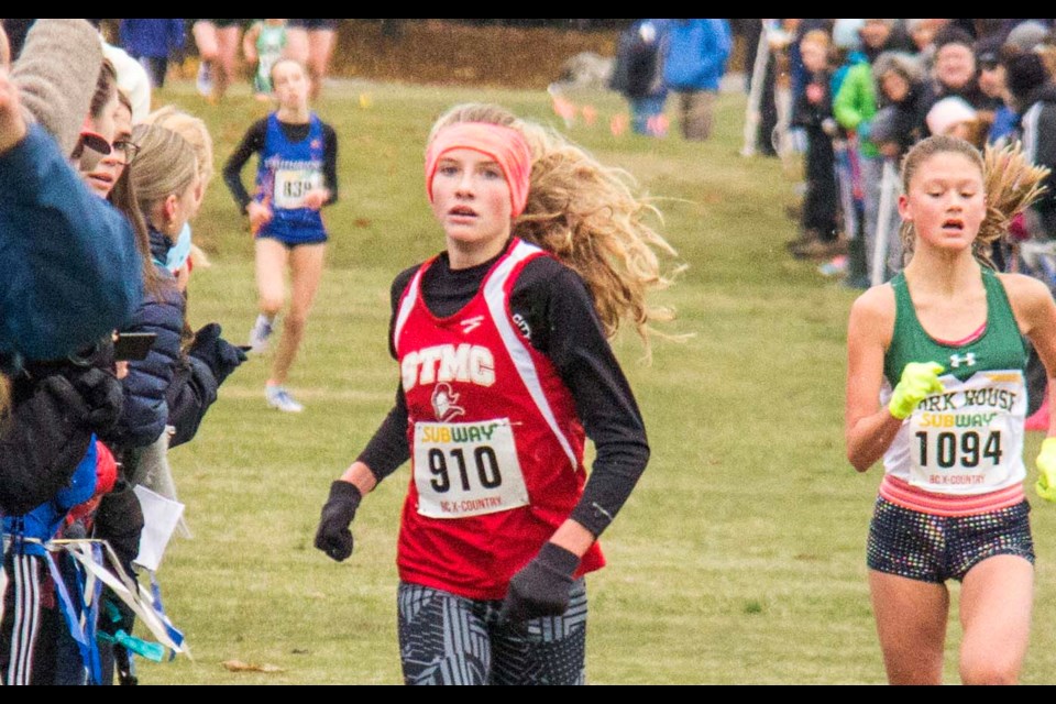 Delivering a strong push for top spot, St. Thomas More's Katie Stewart-Barnett finished third overall among junior girls at the B.C. High School cross country championships in Vancouver.
